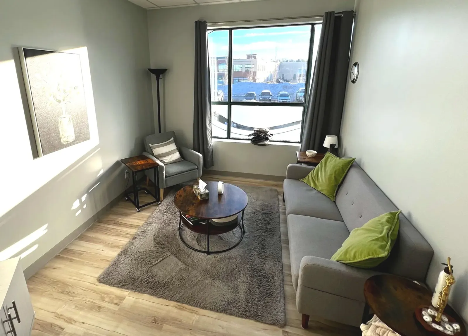 The Empower room with a sofa and window